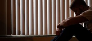 a man sitting by the window