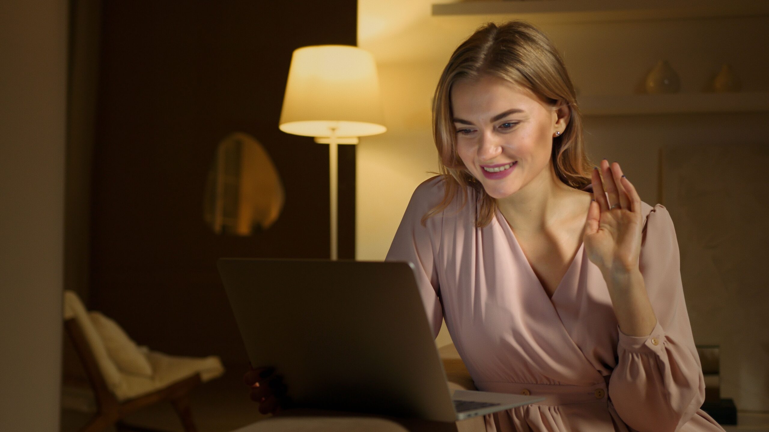 a person sitting comfortably at home on a secure video call with a therapist